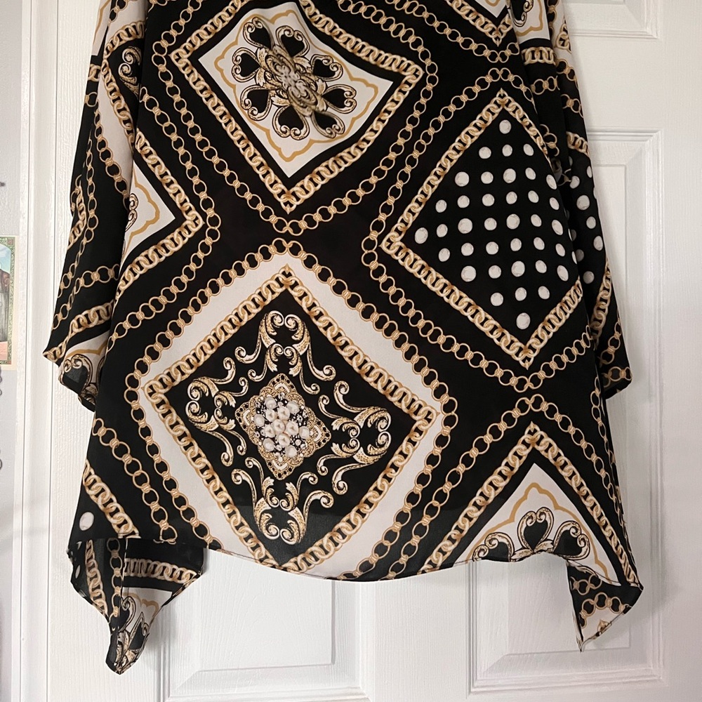 Chico’s Black and Gold Patterned Scarf blouse.